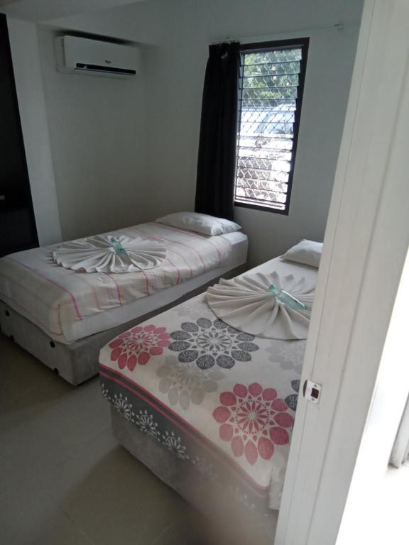 Postel nebo postele na pokoji v ubytování Island Accommodation Suva Premier Hospitality