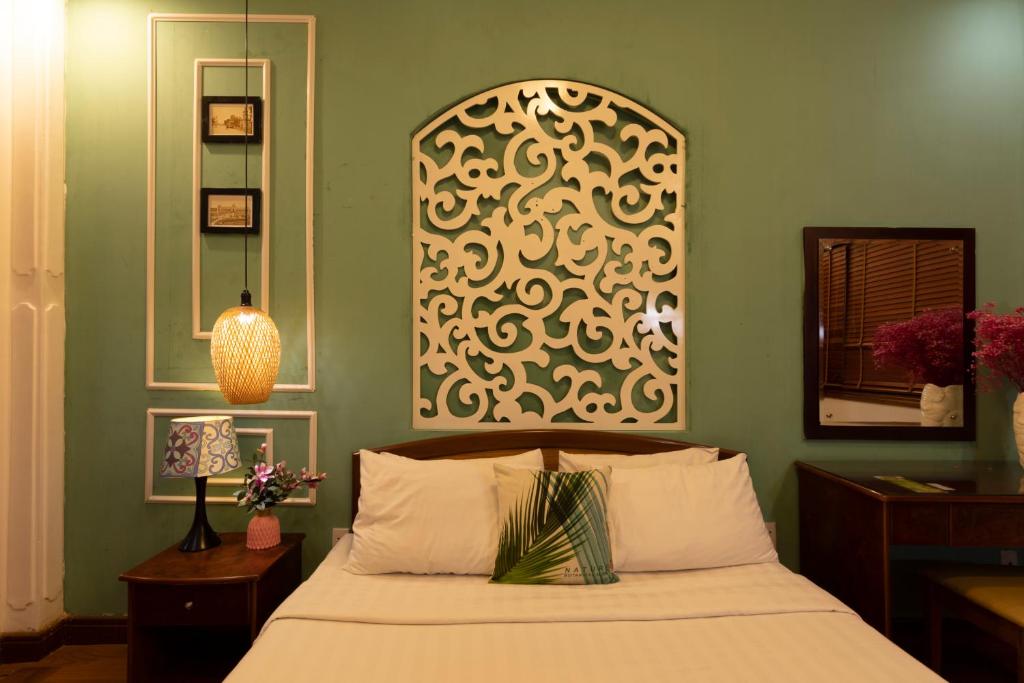 Giường trong phòng chung tại Vilion Central Hotel & Spa