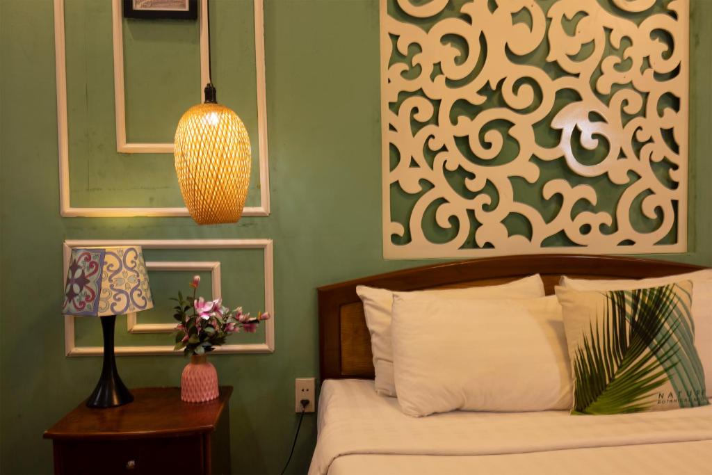 Giường trong phòng chung tại Vilion Central Hotel & Spa