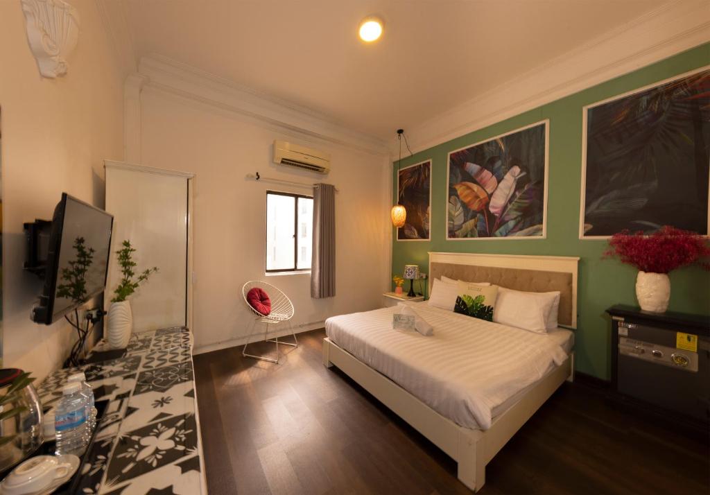 Giường trong phòng chung tại Vilion Central Hotel & Spa