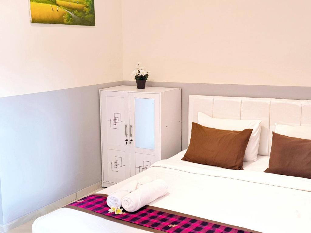 Postel nebo postele na pokoji v ubytování Guest House 88 Pandawa