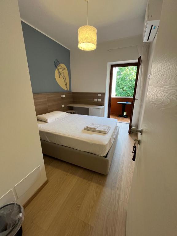 Postel nebo postele na pokoji v ubytování Hotel Al Pescatore