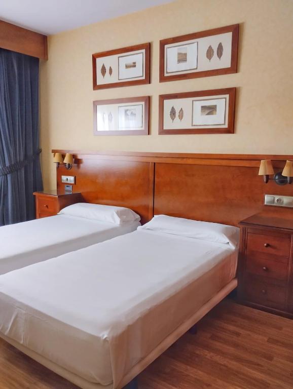 Postel nebo postele na pokoji v ubytování Hostal Los Infantes