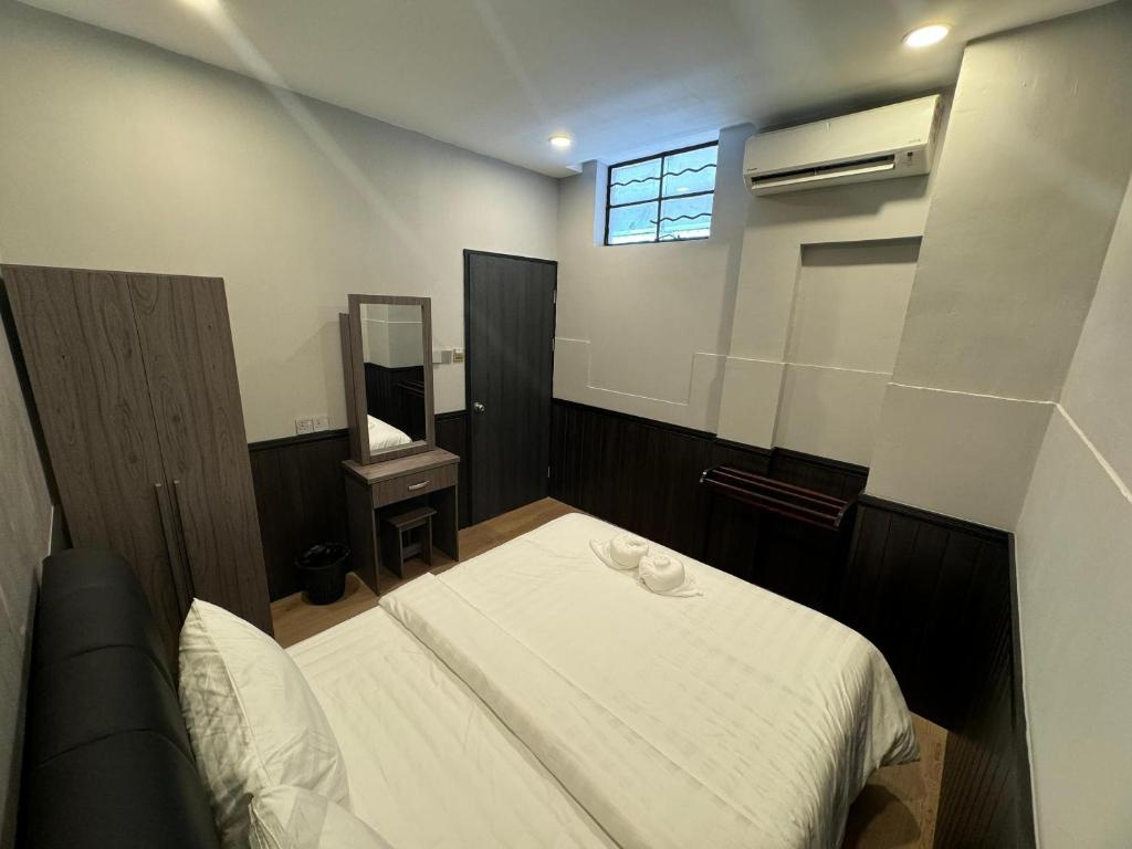Postel nebo postele na pokoji v ubytování Concrete Jungle Cabin