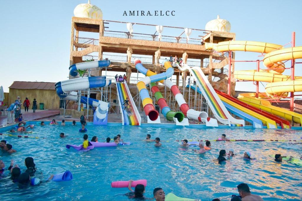 a group of people in the water at an amusement park at الف ليله و ليله اكوا بارك بورسعيد in Port Said