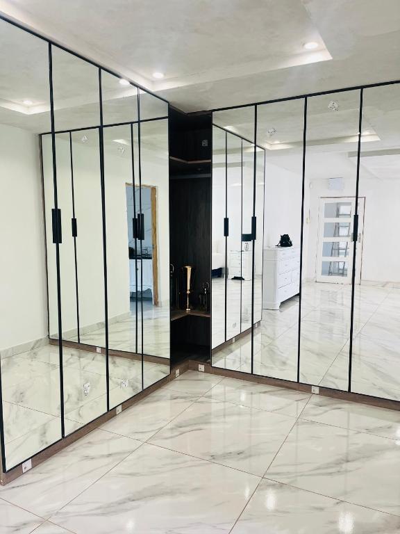 a large room with glass doors on the wall at Mafjoint3 in Zeerust