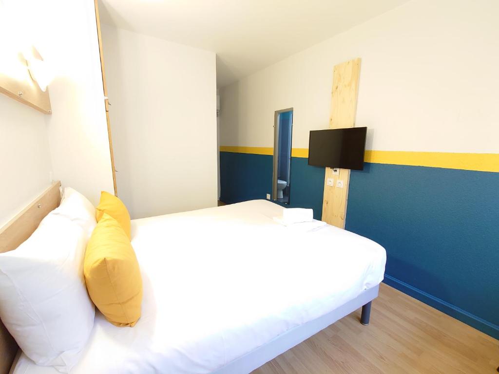 Postel nebo postele na pokoji v ubytování greet hotel Grenoble Centre Gare