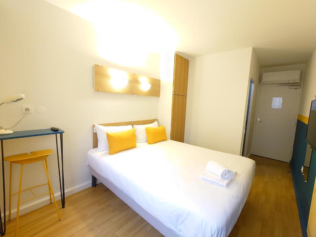 Postel nebo postele na pokoji v ubytování greet hotel Grenoble Centre Gare