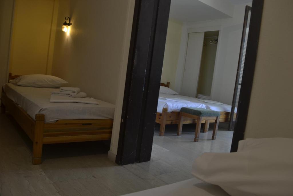 Postel nebo postele na pokoji v ubytování Hotel Maro