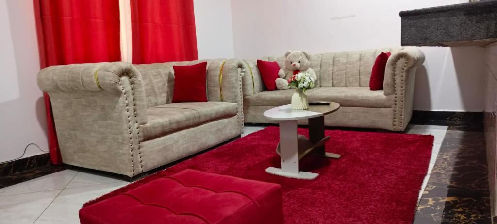 a living room with a couch and a table at One Bedroom Bamburi in Mombasa