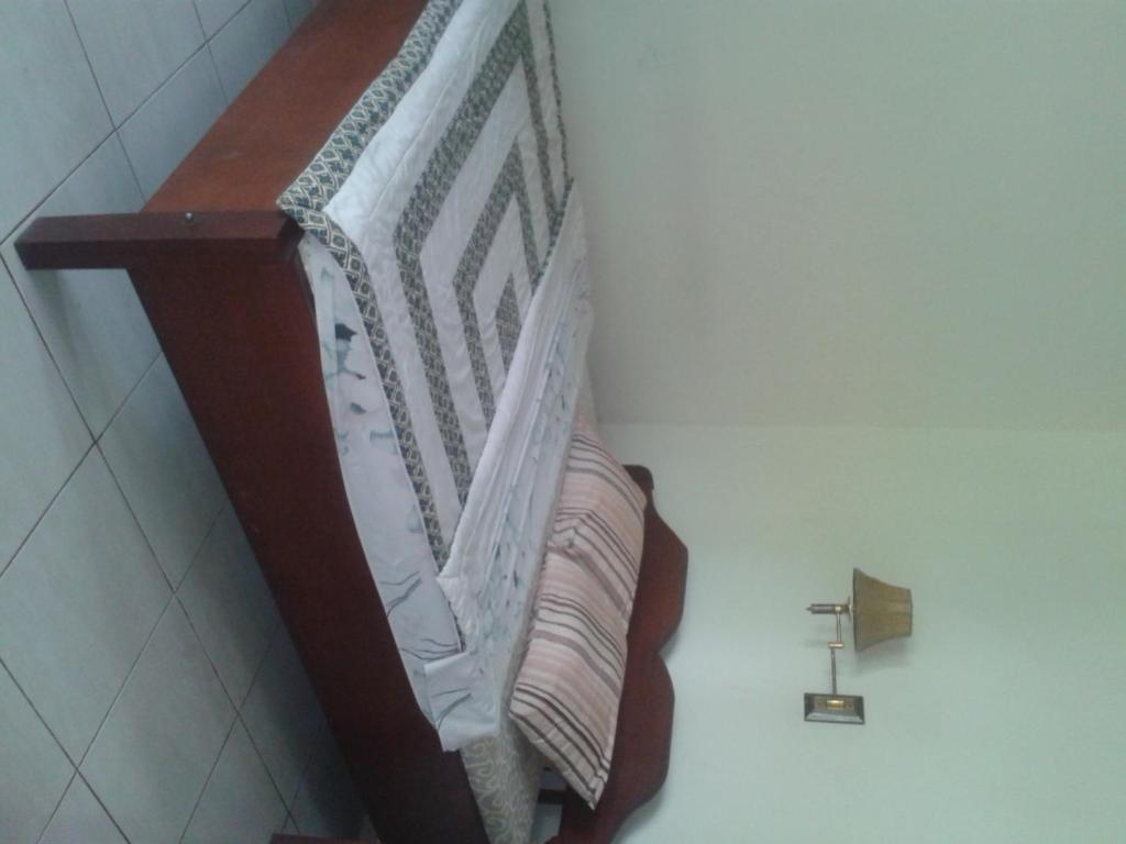 Postel nebo postele na pokoji v ubytování Indraprastha Ubud Home Stay