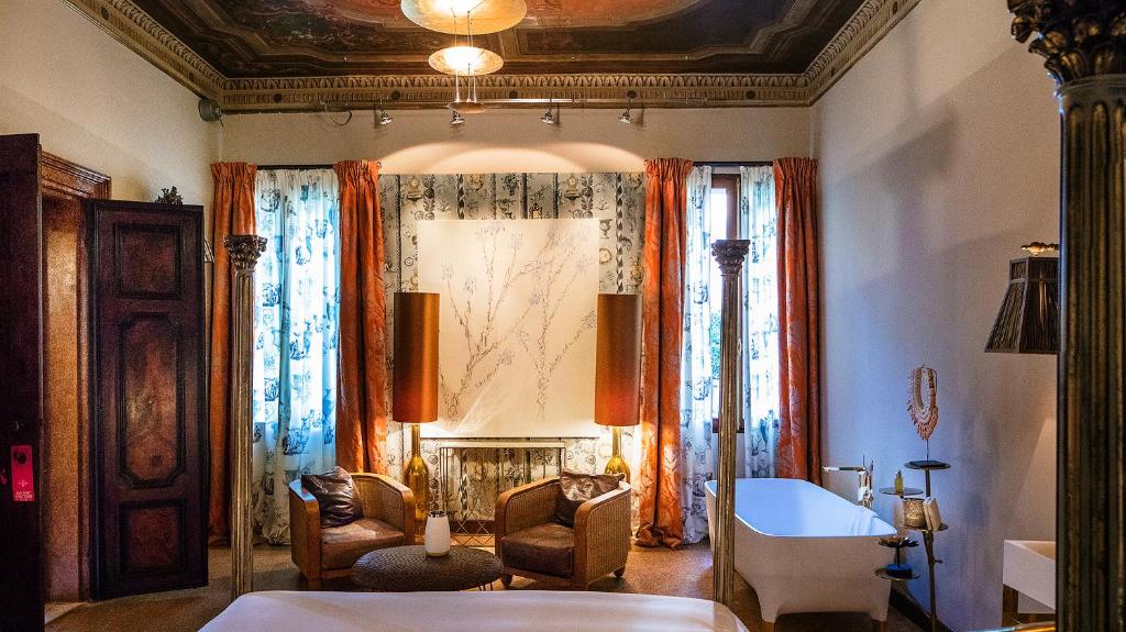 Postel nebo postele na pokoji v ubytování Hotel Heureka