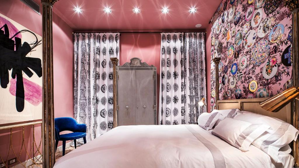 Postel nebo postele na pokoji v ubytování Hotel Heureka