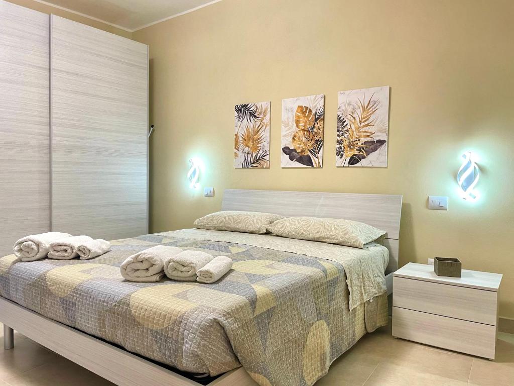 Postel nebo postele na pokoji v ubytování Casa Nina - 10' dalla spiaggia