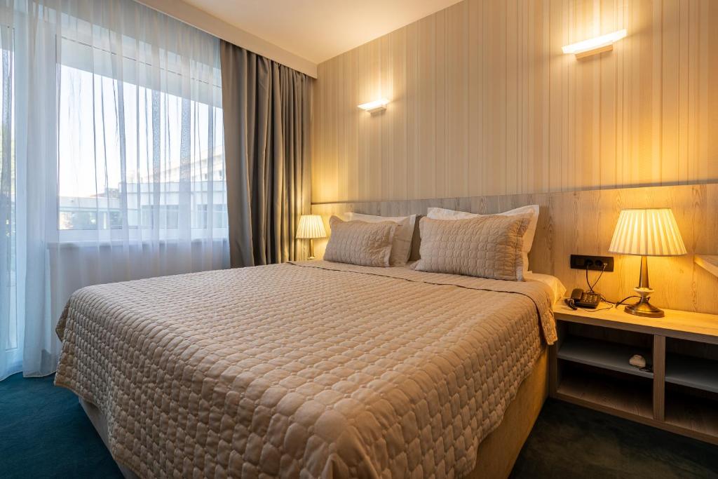 Postel nebo postele na pokoji v ubytování Hotel Dorna
