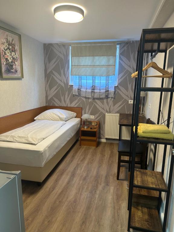Postel nebo postele na pokoji v ubytování Hotel Pirol