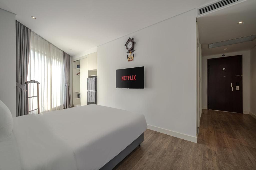 Postel nebo postele na pokoji v ubytování A25 Hotel - 18 Nguyễn Hy Quang