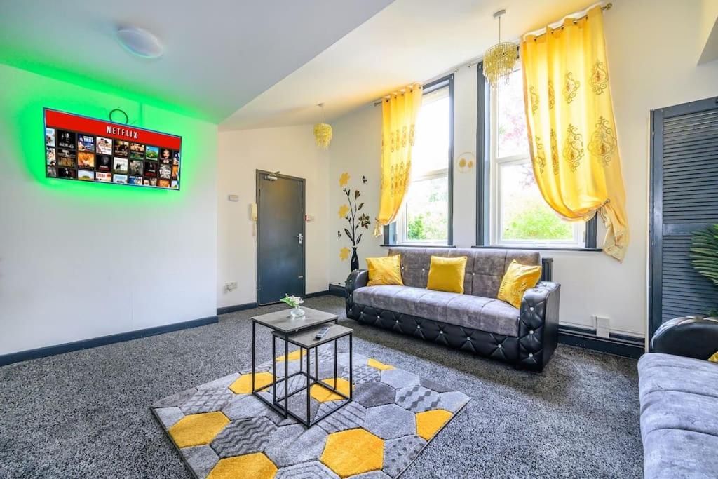 a living room with a couch and a table at -F5GH- For relaxed & Cosy stay, Free Parking, WiFi in Leeds