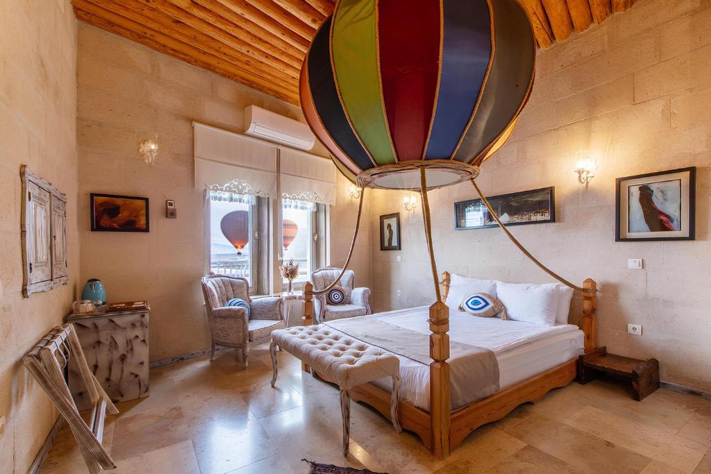Postel nebo postele na pokoji v ubytování Karlık Cave Suite Cappadocia