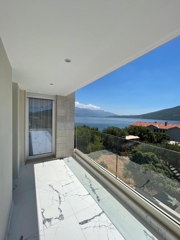 a balcony with a view of the ocean at Villa Le Grand Bleu in Đenovići
