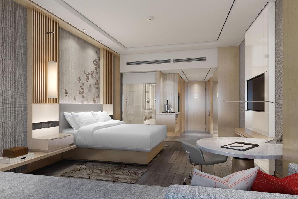 Postel nebo postele na pokoji v ubytování Courtyard by Marriott Shanghai Songjiang
