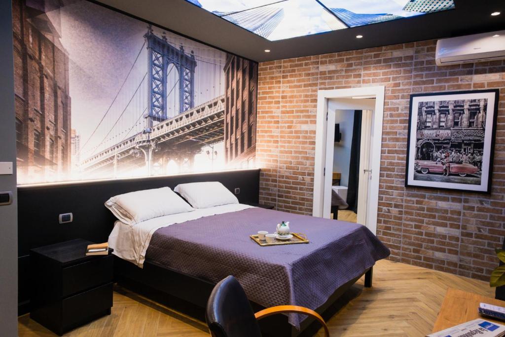 Ένα ή περισσότερα κρεβάτια σε δωμάτιο στο Palazzo Rosso Rooms & Suites