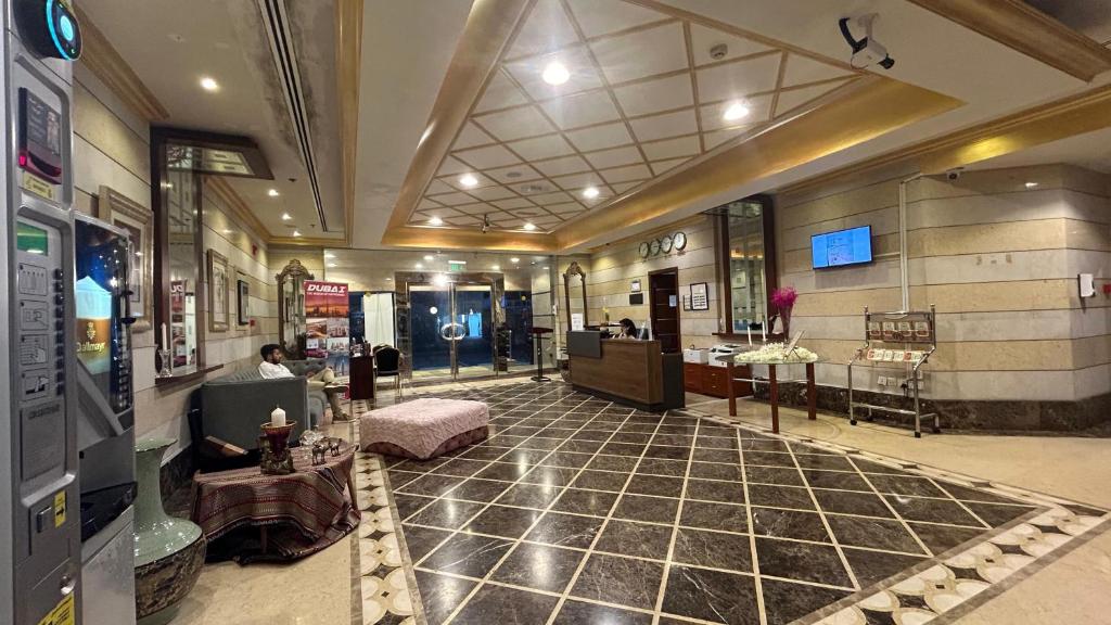 a lobby of a building with a room with a lobby at Al Raya Hotel Apartments in Dubai