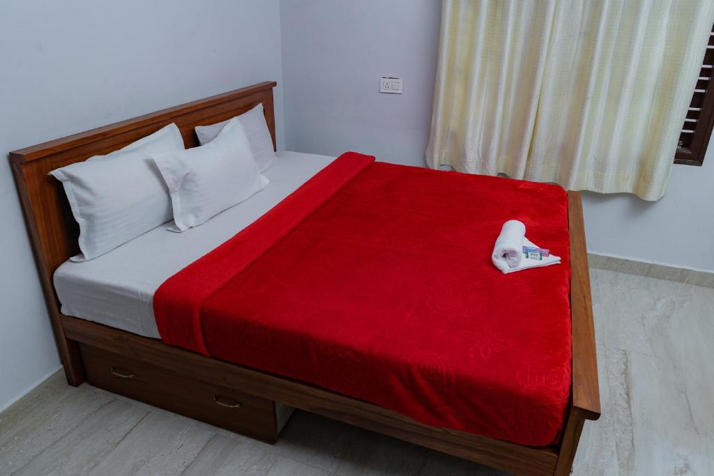 Postel nebo postele na pokoji v ubytování Coorg Residency home stay