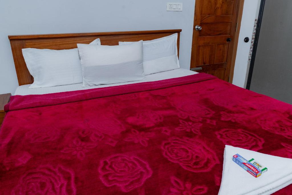 Postel nebo postele na pokoji v ubytování Coorg Residency home stay