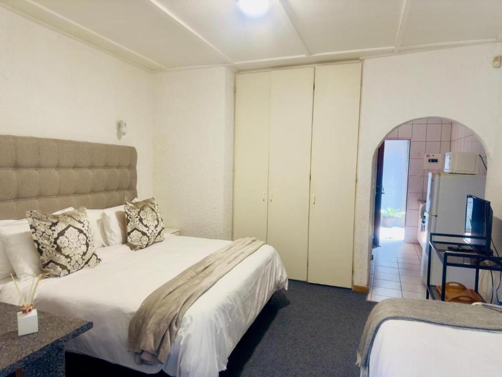 Ένα ή περισσότερα κρεβάτια σε δωμάτιο στο Busa House - Triple Room
