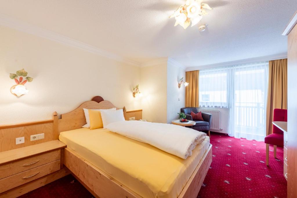 Ein Bett oder Betten in einem Zimmer der Unterkunft Hotel Jägerhof