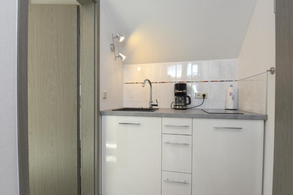 Kuchyň nebo kuchyňský kout v ubytování Studioappartment SAALEBLICK