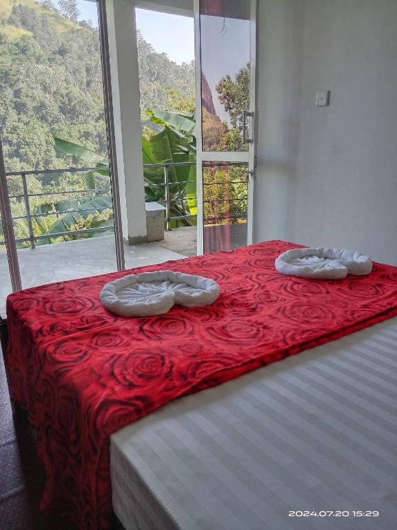 Postel nebo postele na pokoji v ubytování Ranuchanu Rockview Inn Ella