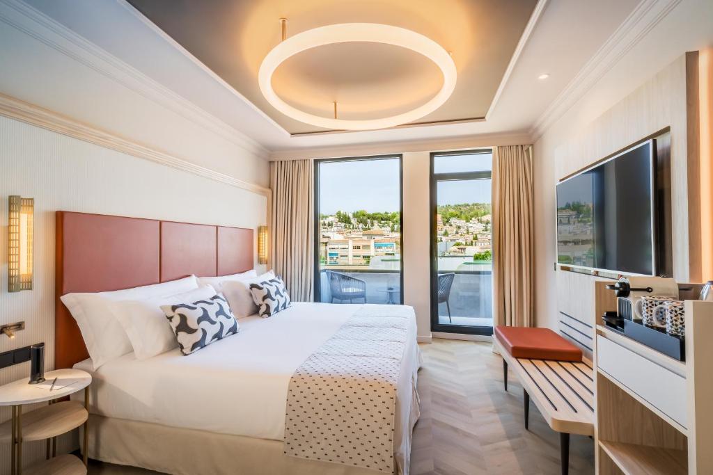 Postel nebo postele na pokoji v ubytování Barceló Carmen Granada