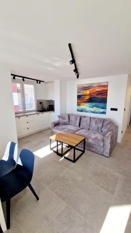 a living room with a couch and a table at Apartament La Mata in La Mata