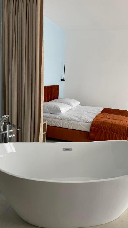 Postel nebo postele na pokoji v ubytování Plaża Resort Łeba & Wellness