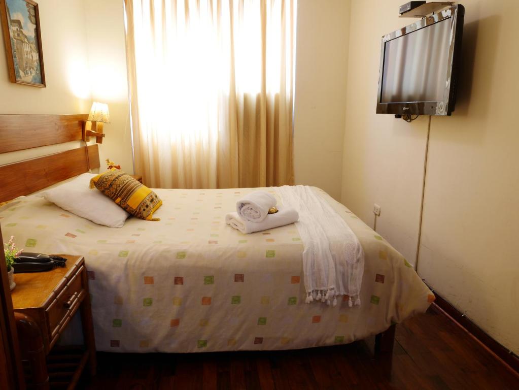 Postel nebo postele na pokoji v ubytování Suite Service Apart Hotel