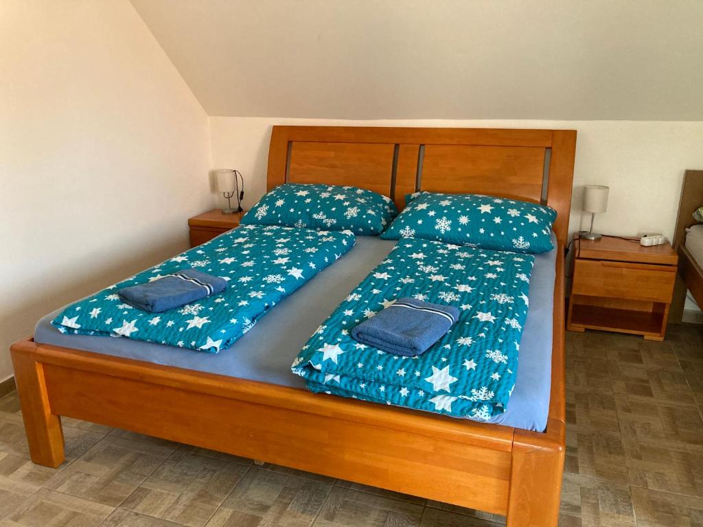 Postel nebo postele na pokoji v ubytování Apartmány s klimatizací - Penzion U Kudláčků Pouzdřany
