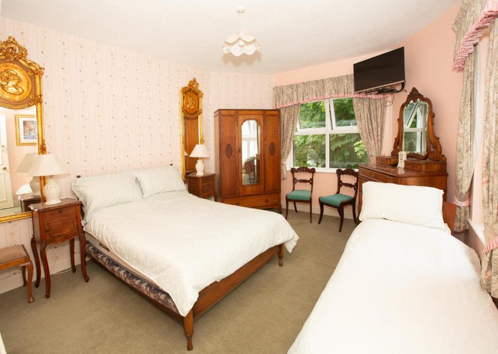 Postel nebo postele na pokoji v ubytování Gleneven Guest House