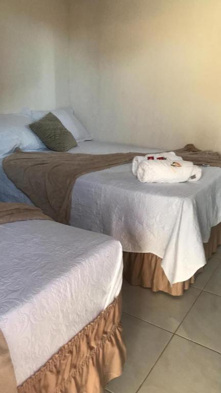 Cama ou camas em um quarto em Pousada Giro das dunas