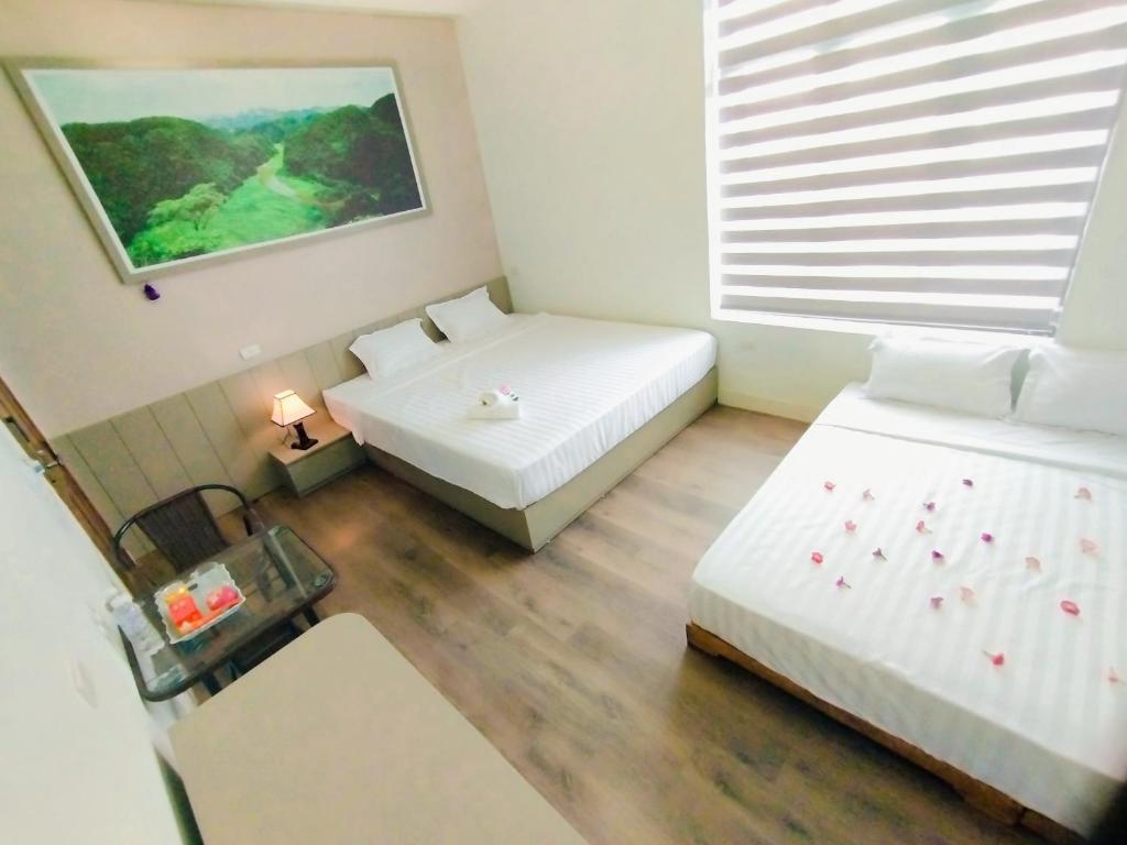 Postel nebo postele na pokoji v ubytování THUY DUNG TAM COC HOMESTAY