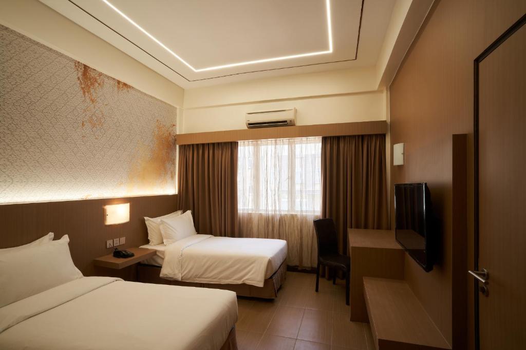 Postel nebo postele na pokoji v ubytování BTC Hotel 比特币酒店