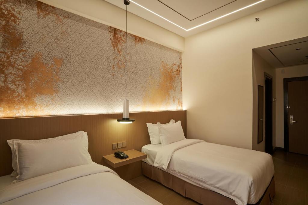 Postel nebo postele na pokoji v ubytování BTC Hotel 比特币酒店