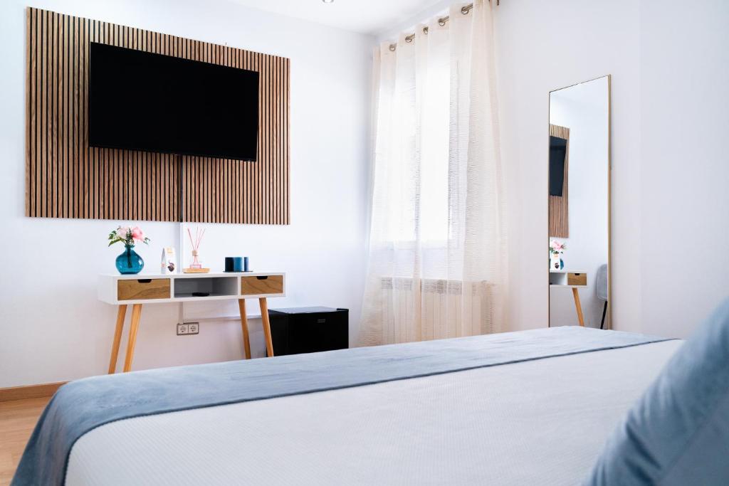 Postel nebo postele na pokoji v ubytování Hotel Puerta de Cazorla
