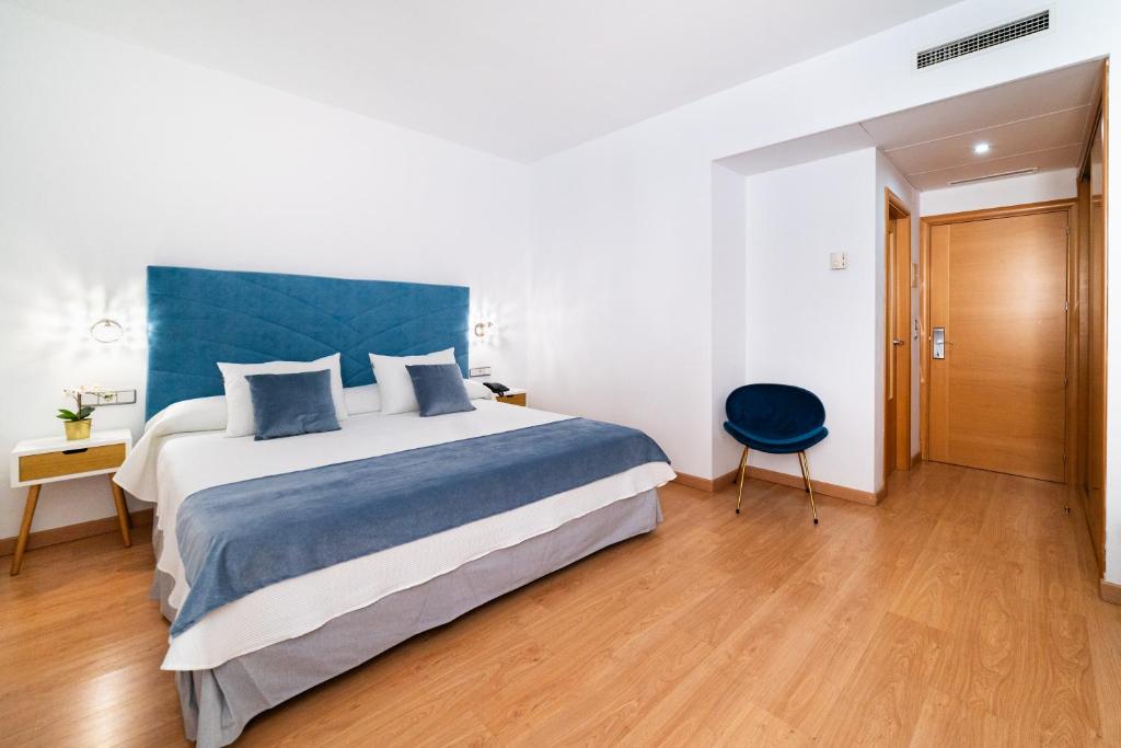 Postel nebo postele na pokoji v ubytování Hotel Puerta de Cazorla