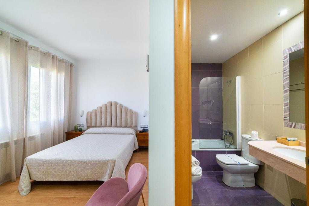 Postel nebo postele na pokoji v ubytování Hotel Puerta de Cazorla