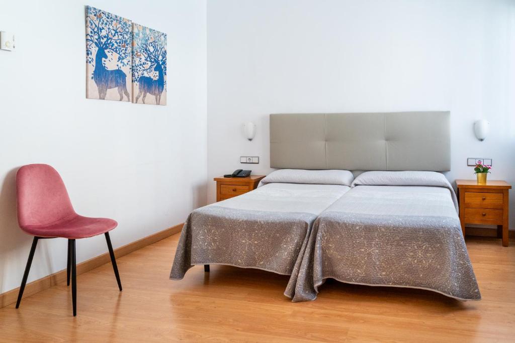 Postel nebo postele na pokoji v ubytování Hotel Puerta de Cazorla