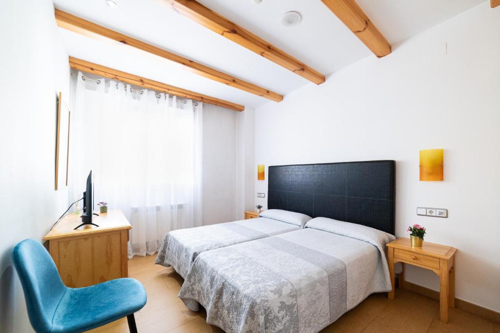 Postel nebo postele na pokoji v ubytování Hotel Puerta de Cazorla