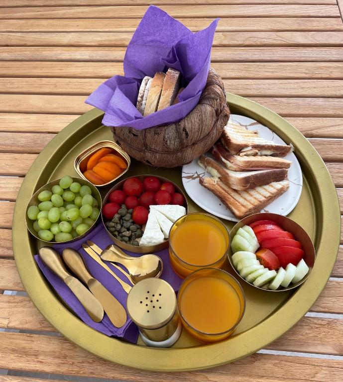 a plate of food with different foods on a table at Oikos Sani Suites in Sani Beach