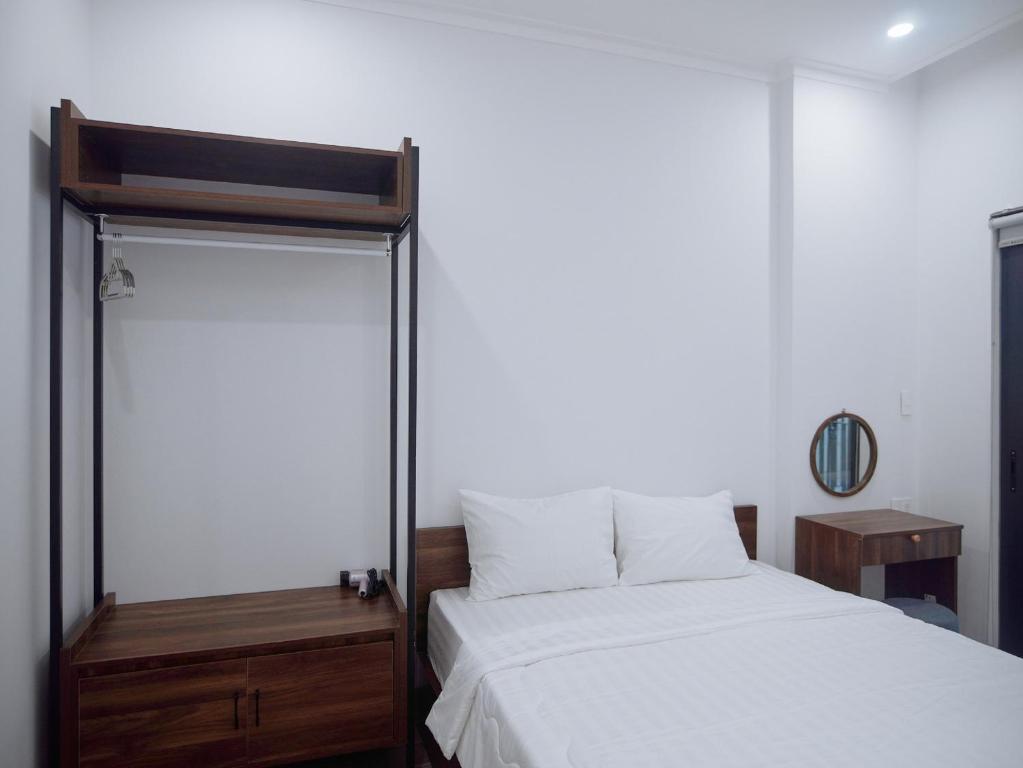 Giường trong phòng chung tại Amber Hotel